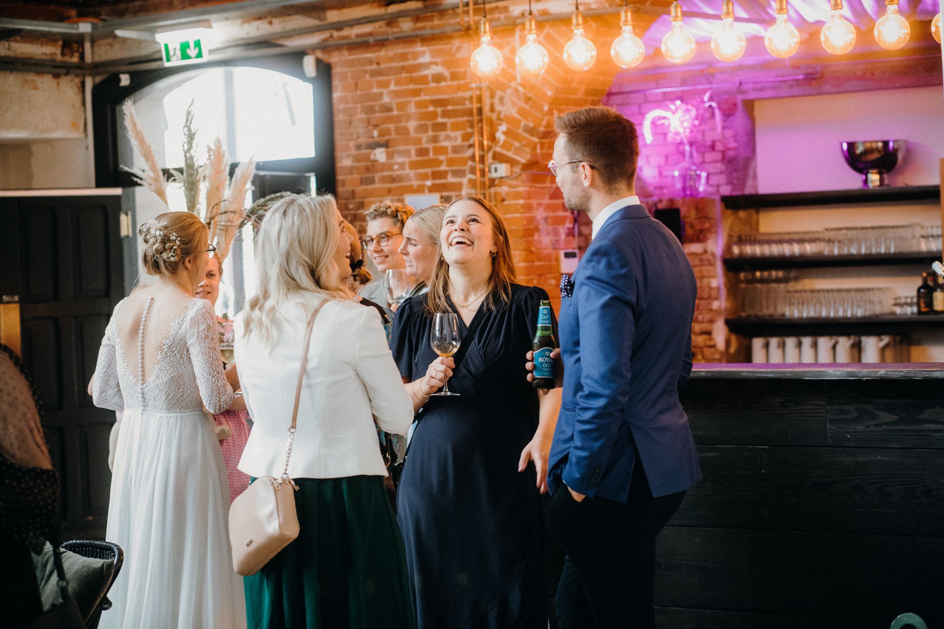 networking-professional-laughing-drinking-wine